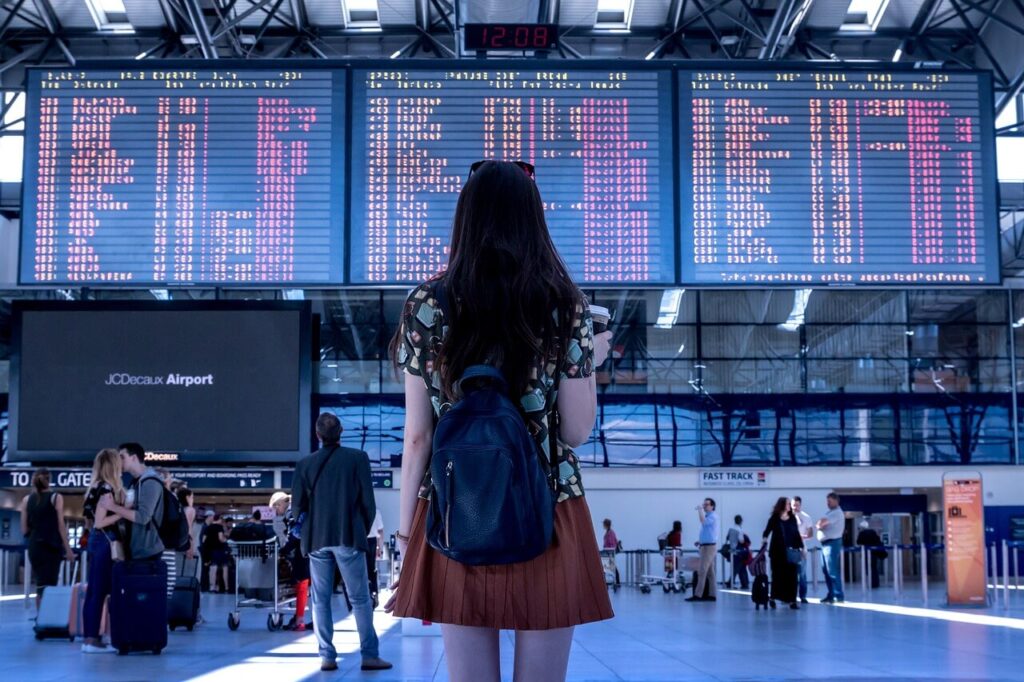 At the airport alone – symbolizing independence and a fresh start in a new country